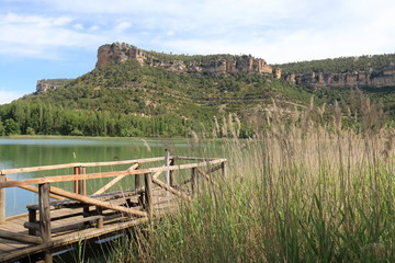 Fototapeta na wymiar Wooden path over the Uña lagoon, in the province of Cuenca, Spain