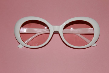 White woman's dough glasses, modern, latest fashion, pink background