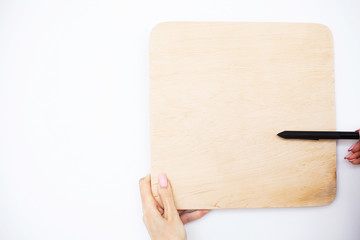 Office Woman Hands Holding a A Tree Board on White Background. Copyspace. Place for Text