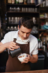 Barista Preparing Coffee In Cup At Cafe