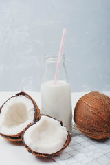 Fresh organic coconut milk in a tube bottle, coconut milkshake,