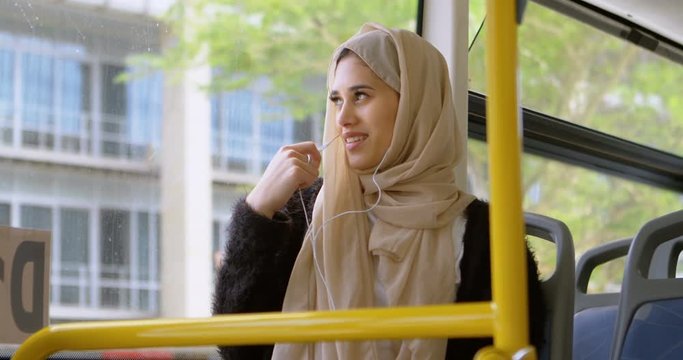 Woman in hijab talking on mobile phone 4k