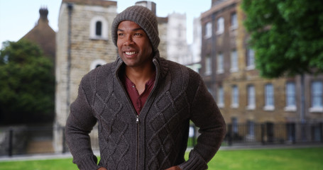 Young African male traveling in England outside on chilly morning 