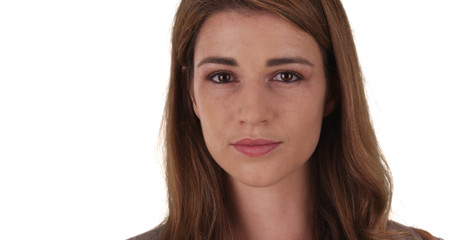 Fototapeta premium Gentle Caucasian female professional looking at camera on white background