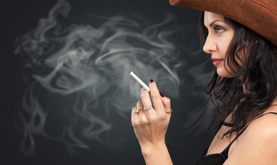 Beautiful elegant girl smoking