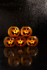 Jack o lantern for halloween 2018 on a black background with rain