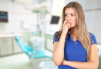 Fototapeta premium Beautiful woman thinking and looking worried