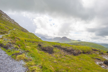 Panorama of mountains, marshy land and heathland of Connemara National Park in summer