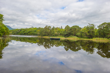 Panorama of edge and surroundings of a lake in a national park in summer