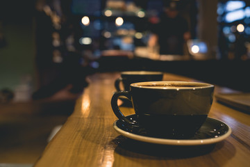 Coffee Cups on bar at Coffee Shop with latte