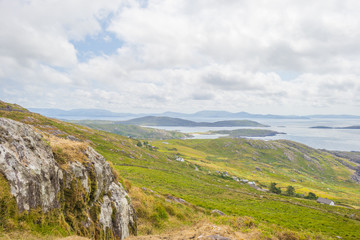 Fototapeta na wymiar Rocky hilly coast of Kerry along the atlantic ocean in summer 