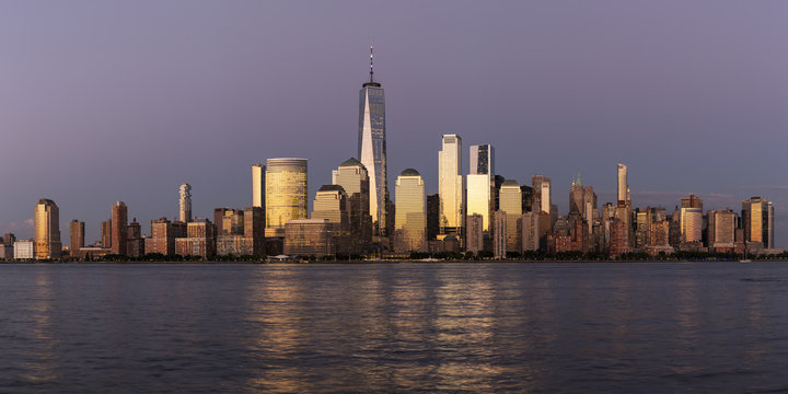 New York City / USA - JUL 19 2018: Lower Manhattan skyline at sunset view from Hudson riverside