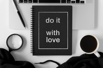 Notebook and laptop on white background.