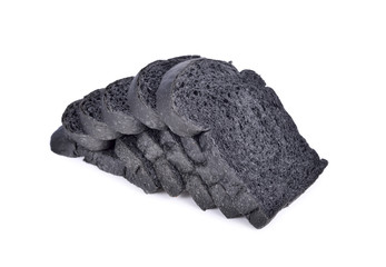 sliced charcoal bread on white background