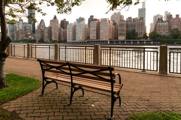 New York City / USA - JUL 27 2018: Midtown Manhattan view from Roosevelt Island at sunset