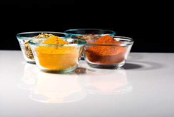 small bowls of ground spices