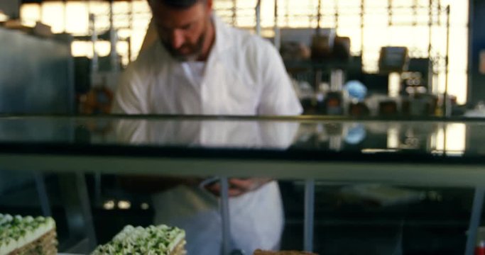 Male chef maintaining records 4k