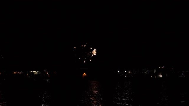 Heart Shaped Fireworks Exploding In Night Sky Over Lake