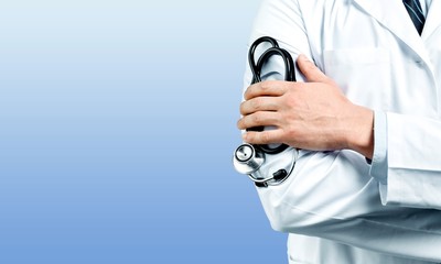 Young man doctor holding stethoscope