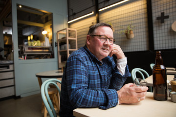 Caucasian Man Sitting in a Coffee Shop