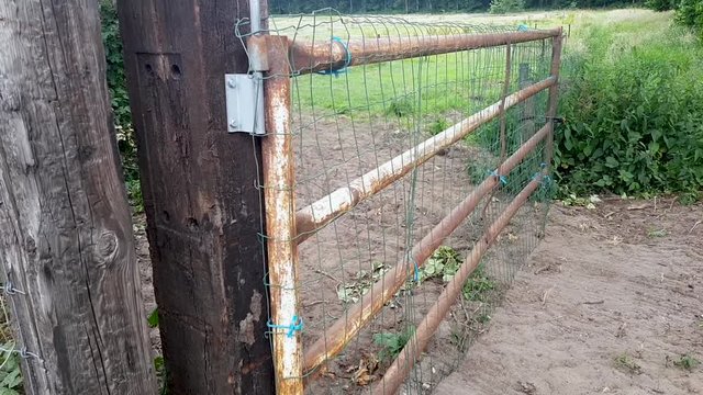 a old fench as an entrance to a field.