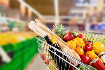 Shopping cart filled with various groceries