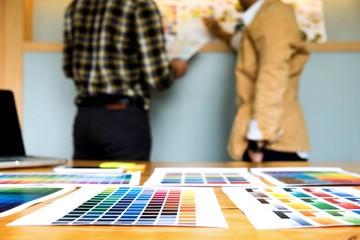 Fototapeta premium Graphic designers choose colors from the color bands samples for design .Designer graphic creativity work concept .