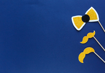 Party photo booth props on blue background. Movember Movement, Father's day concept. flat lay, top view, copyspace