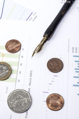vintage fountain pen with coin, financial paper
