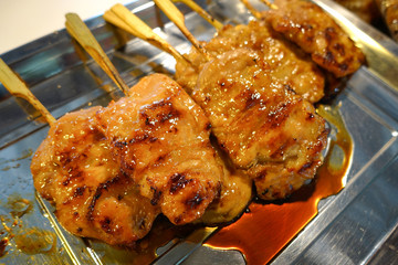 grilled skewered milk pork with white sticky rice - local Thai street food style