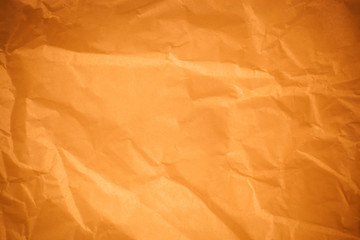 Brown crumpled paper background.
