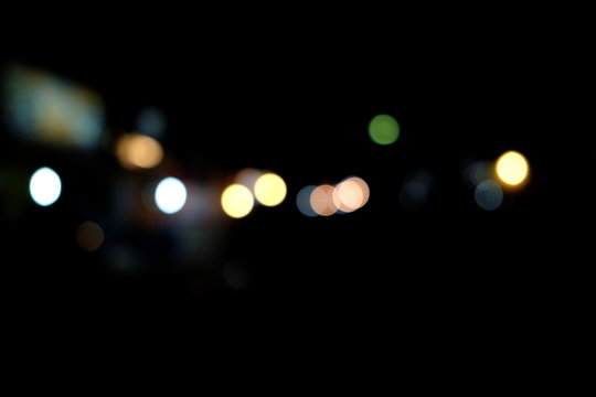 Abstract urban night light bokeh, defocused background © bebuntoon
