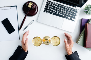 justice and law concept.Male lawyer in the office with brass scale and gavel and laptop and legal...