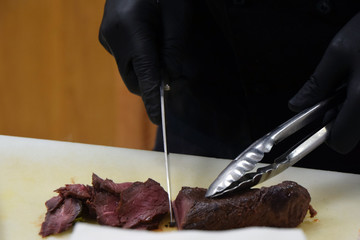 Chef preparing kangaroo steak