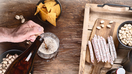 Man pouring beer into glass