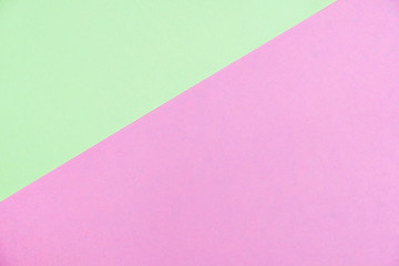 Pastel colored paper flat lay top view, background texture, green and pink