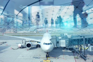 Multiple exposure of passenger wlaking in Aitport with departure airplane at the gate.  