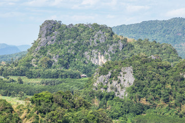 Fototapeta na wymiar High angle landscape view over rainforest limestone mountains from Phu Pa Por view point at Loei province ,Thailand .