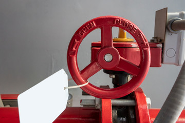 Industrial steel pipes in red with wheel on white background.