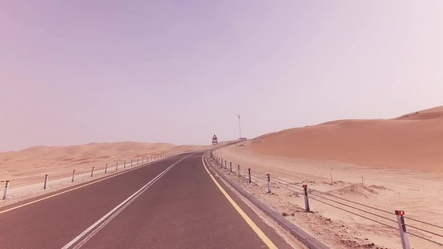 New road from Oasis Liwa to Moreeb Dune in Rub al Khali desert stock footage video