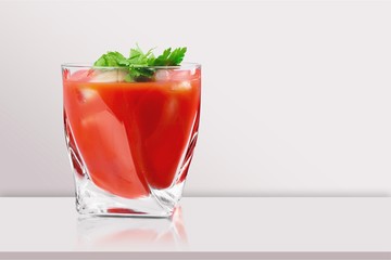 Glass of alcohol cocktail on desk