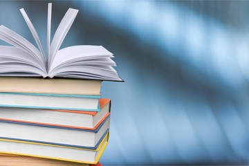Books collection in pile on background