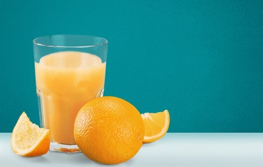 Orange juice and slices of orange on