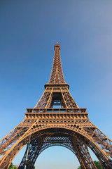 The amazing Eiffel Tower in Paris during sunset. Tower is one of the most recognizable landmarks in the world. Famous touristic place and romantic travel destination in Europe. Paris, France