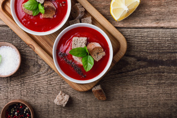 Tomato soup  with rye bread croutons and thyme, top view