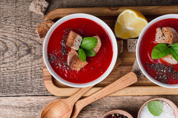 Tomato soup  with rye bread croutons and thyme, top view
