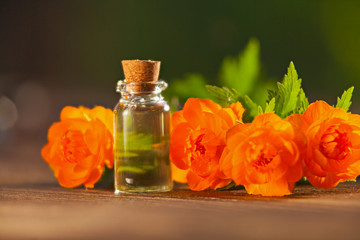 Essence of lavender flowers on table in beautiful glass Bottle