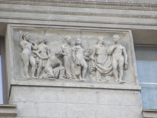 Fragment of the building with bas-relief, architectural decoration