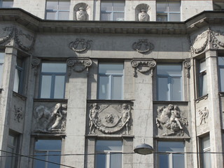 Fototapeta na wymiar Fragment of a beautiful building with windows