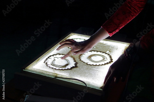 Sand Animation Hands S Draw Paint An Ilration With Sand Animation Hands S Draw Paint An Ilration With On Light Table